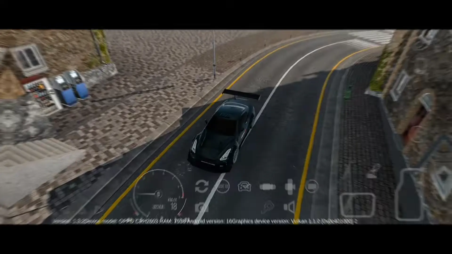 Car driving along a curved street between stone buildings in Italy